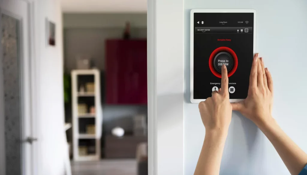 A smart home security system with a tablet in the wall of the entrance of a room