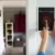 A smart home security system with a tablet in the wall of the entrance of a room