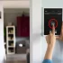 A smart home security system with a tablet in the wall of the entrance of a room