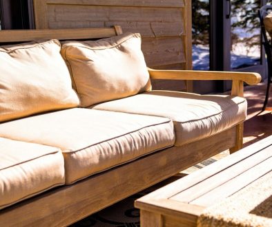 brown wooden futon placed near coffee table